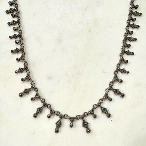 Sterling silver necklace with hematite stones.